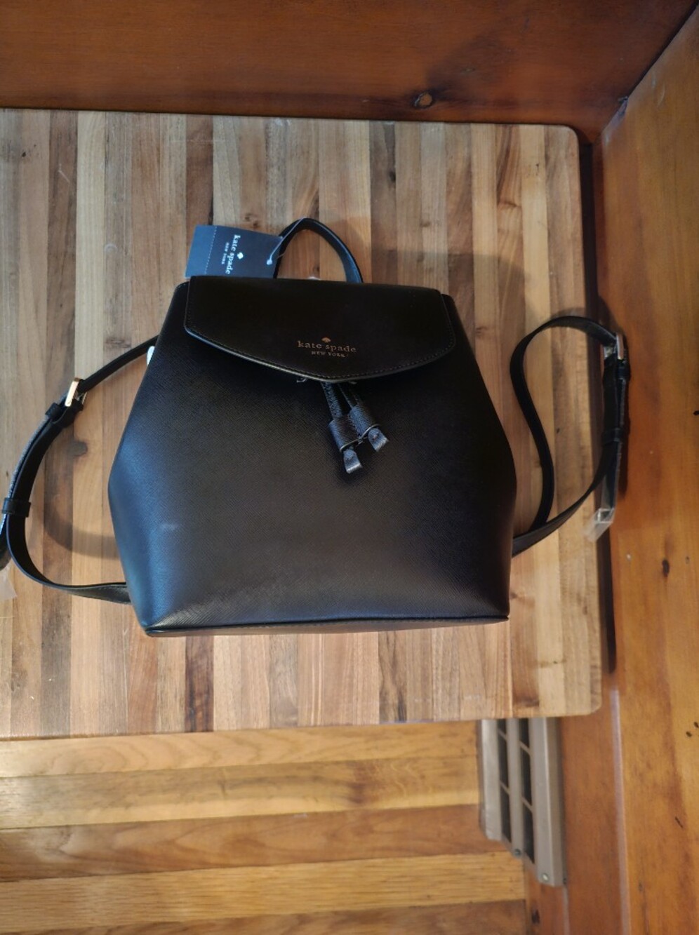 Kate Spade Black Saffiano Leather Backpack with Tassel Flap Pocket